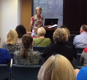 Moderator Jackie Hayes speaking for the premier caregiver services event